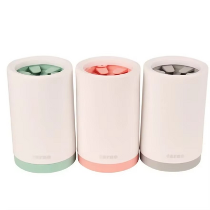 Three cylindrical containers with pastel-colored bases on a white background